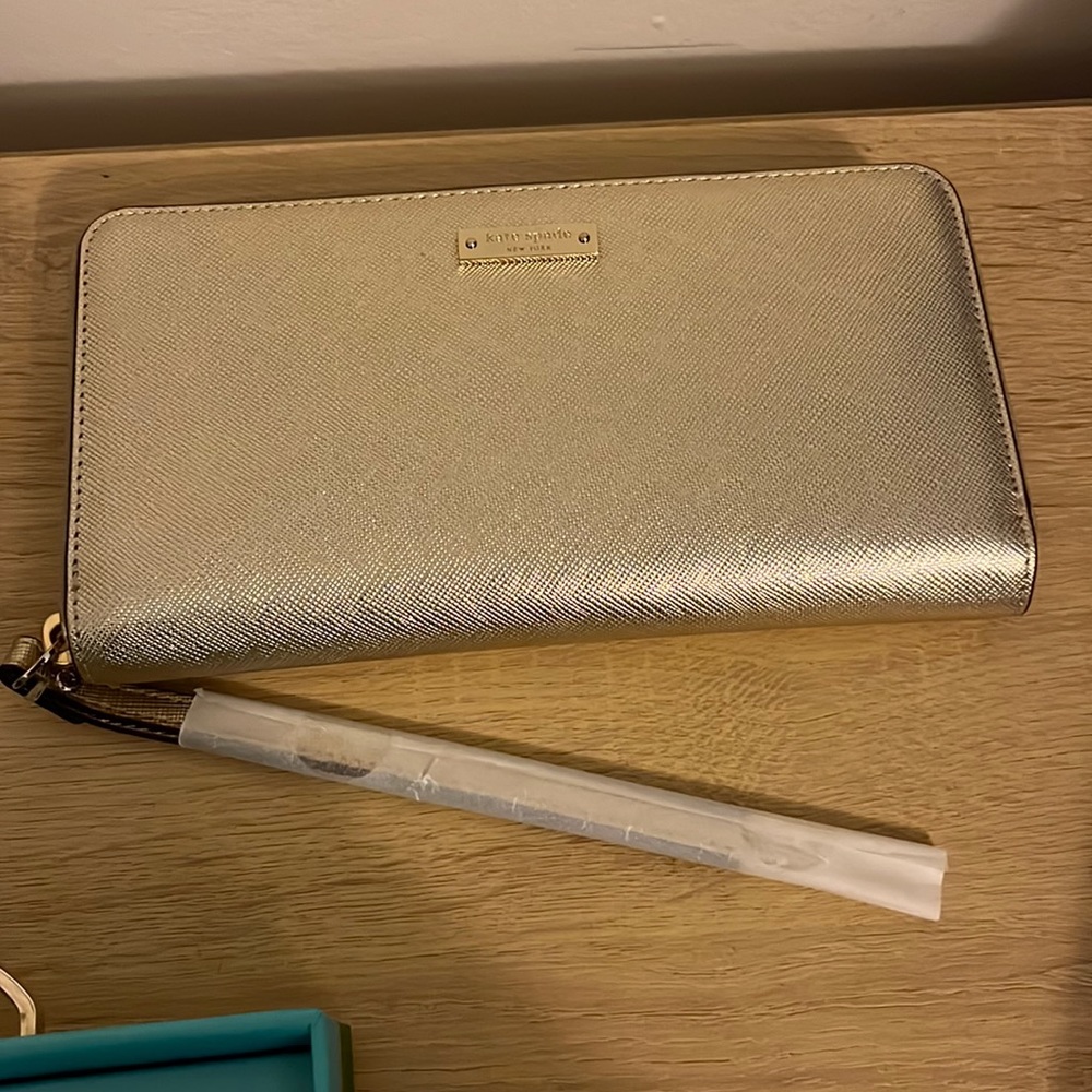 Kate Spade gold wristlet.